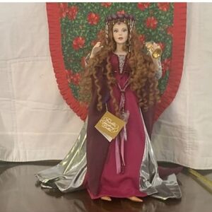 Franklin Mint Beautiful Collector Doll In A Magenta and Silver Dress.